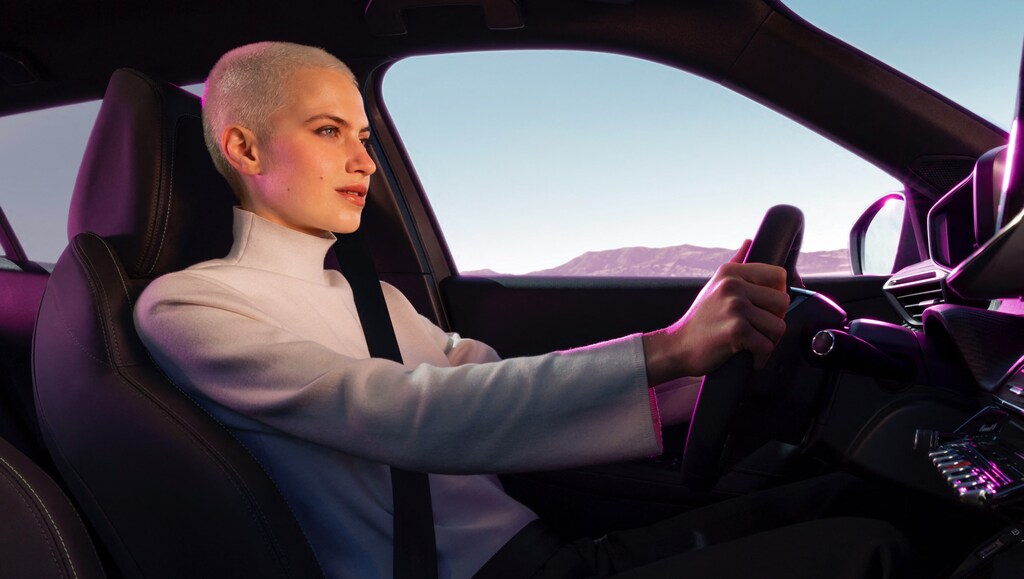 Woman driving a hybrid Peugeot